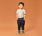 Boy wearing Ten Little Everyday Original - Emerald Green. Available at www.tenlittle.com