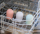 Ezpz Mini Cup & Straw in different colors at the dishwasher - Available at www.tenlittle.com