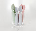 Ezpz Mini Utensils set of 2 inside of drinking glass in different colors- Available at www.tenlittle.com