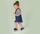 Girl walking and wearing Ten Little First Walkers - Navy Blue. Available at www.tenlittle.com