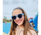 Girl wearing Roshambo Round Sunglasses - Cloudy Blue. Available at www.tenlittle.com