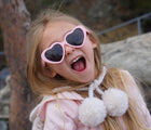 Girl wearing Ten Little Roshambo Heart Sunglasses - Pink. Available at www.tenlittle.com