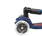 Close up of light-up wheel on Micro Kickboard Maxi Deluxe Foldable LED Scooter - Navy Blue/Red. Available at www.tenlittle.com