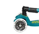 Close up of light-up wheel on Micro Kickboard Maxi Deluxe Foldable LED Scooter - Petrol Green. Available at www.tenlittle.com