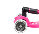 Close up of light-up wheel on Micro Kickboard Maxi Deluxe Foldable LED Scooter - Shocking Pink. Available at www.tenlittle.com