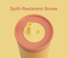 Top view of spill-resistant straw and Owala Stainless Steel Tumbler - 12oz - Orange. Available at www.tenlittle.com