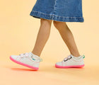 Side view of child wearing Ten Little Everyday Original - Neon Glow - Neon Pink. Available at www.tenlittle.com