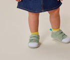 Girl wearing Ten Little First Walkers - Sage Green. Available at www.tenlittle.com