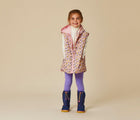 Girl wearing Ten Little Snow Boots in Navy and Pink. Available at www.tenlittle.com