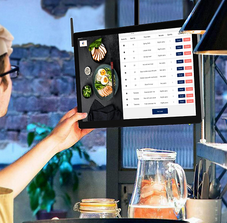 QSR staff using touchscreen to select menu items via LineTen’s OrderPro system for streamlined in-store ordering.