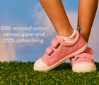 View of child wearing Ten Little Eco Canvas Sneakers - Piggy Pink made with a 100% recycled cotton canvas upper and 100% recycled cotton lining. Available at www.tenlittle.com