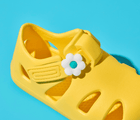 Close up of Ten Little Daisy Yellow Splash Sandals with Splash Sandal Charms 2 on - Daisy. Available at www.tenlittle.com