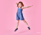 Girl age 4 jumping wearing Ten Little Everyday Sandals 2 - Slate Blue. Available at www.tenlittle.com